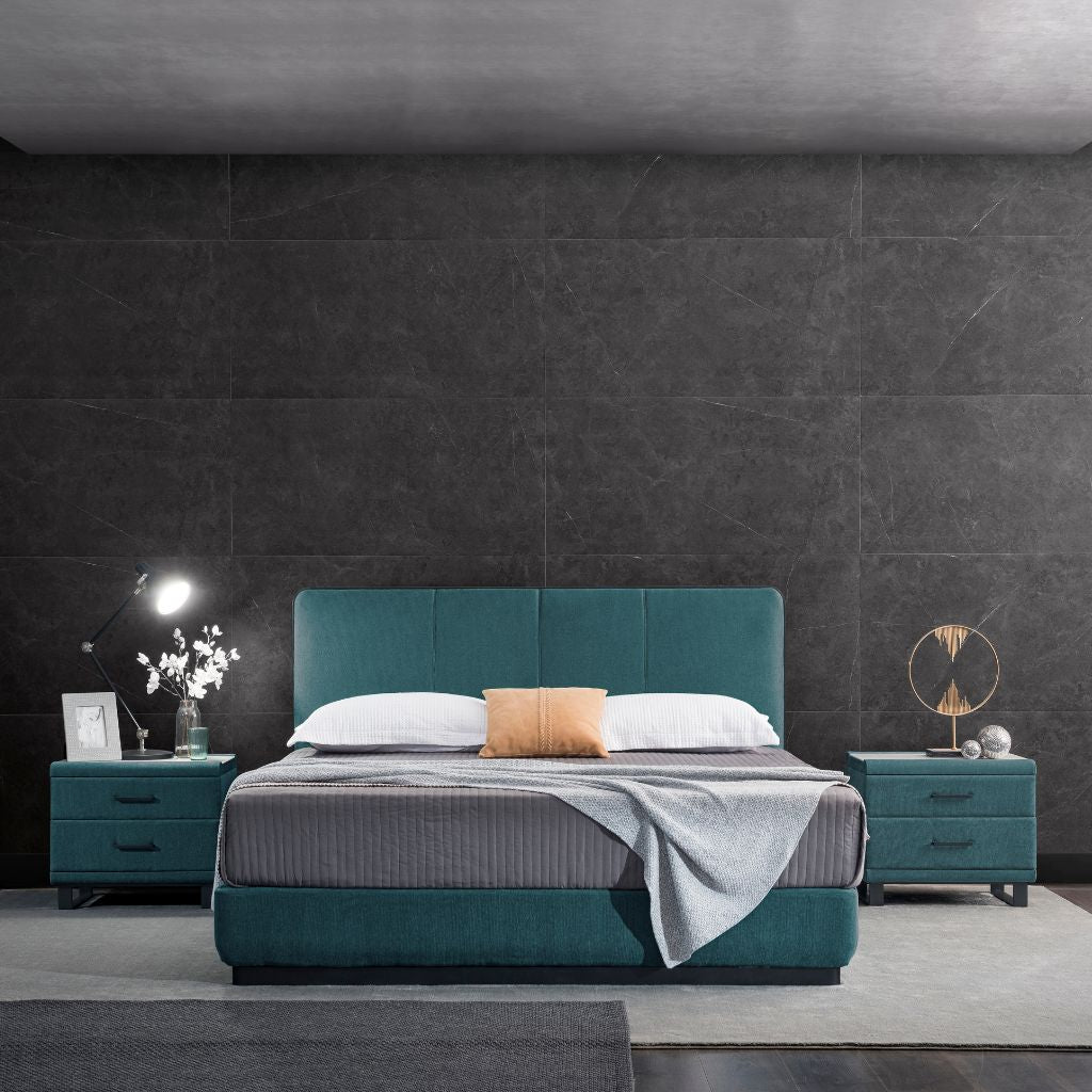 Oakland Bed with an upholstered headboard and satin black metalwork edge detailing in a modern bedroom