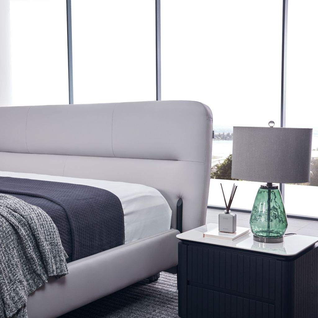 Odessa Bed in leather showing the minimalist upholstered design