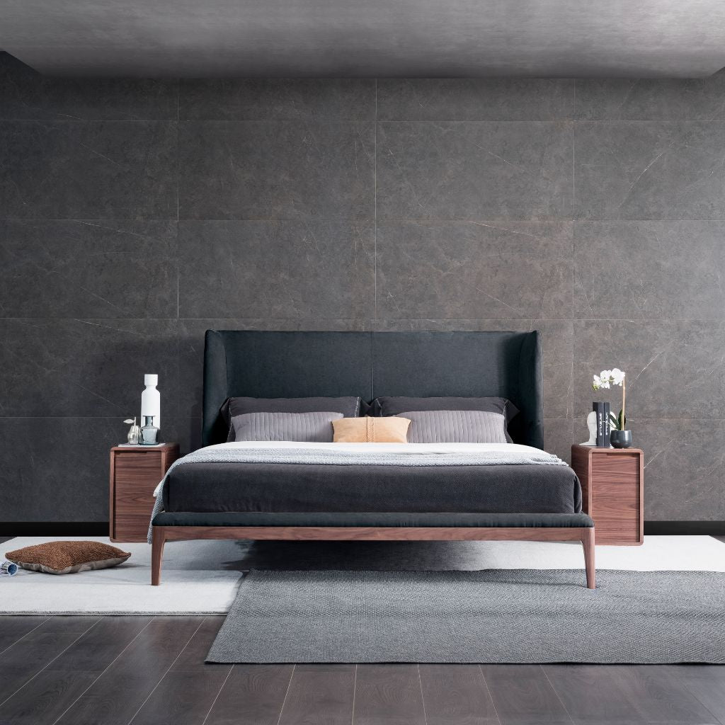 Olivia Bed with a raised American Walnut timber frame and sofa-style headboard in a modern bedroom