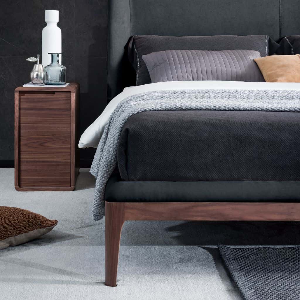Olivia King Size Bed showing the raised timber frame and rounded legs
