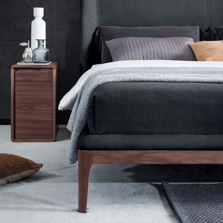 Olivia King Size Bed showing the raised timber frame and rounded legs