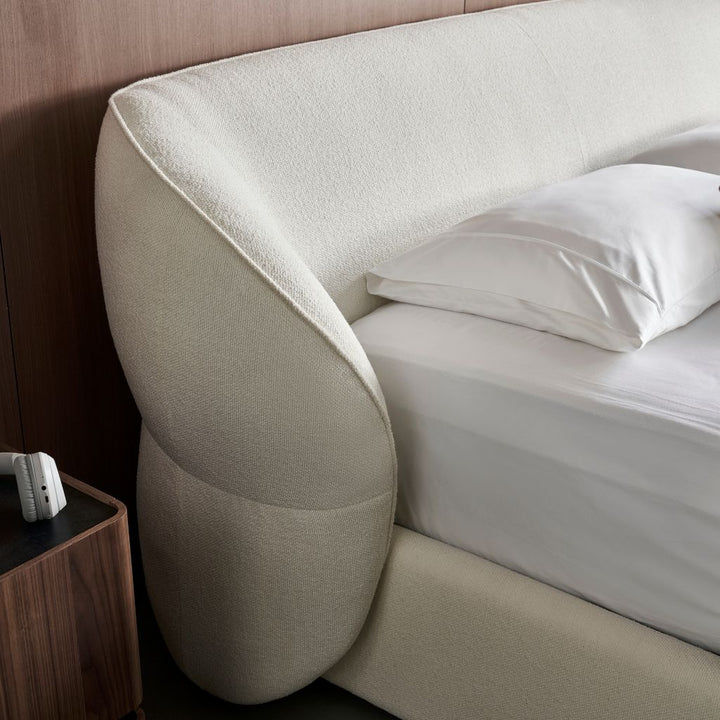 Pescara Bed full view showing the curved upholstered frame