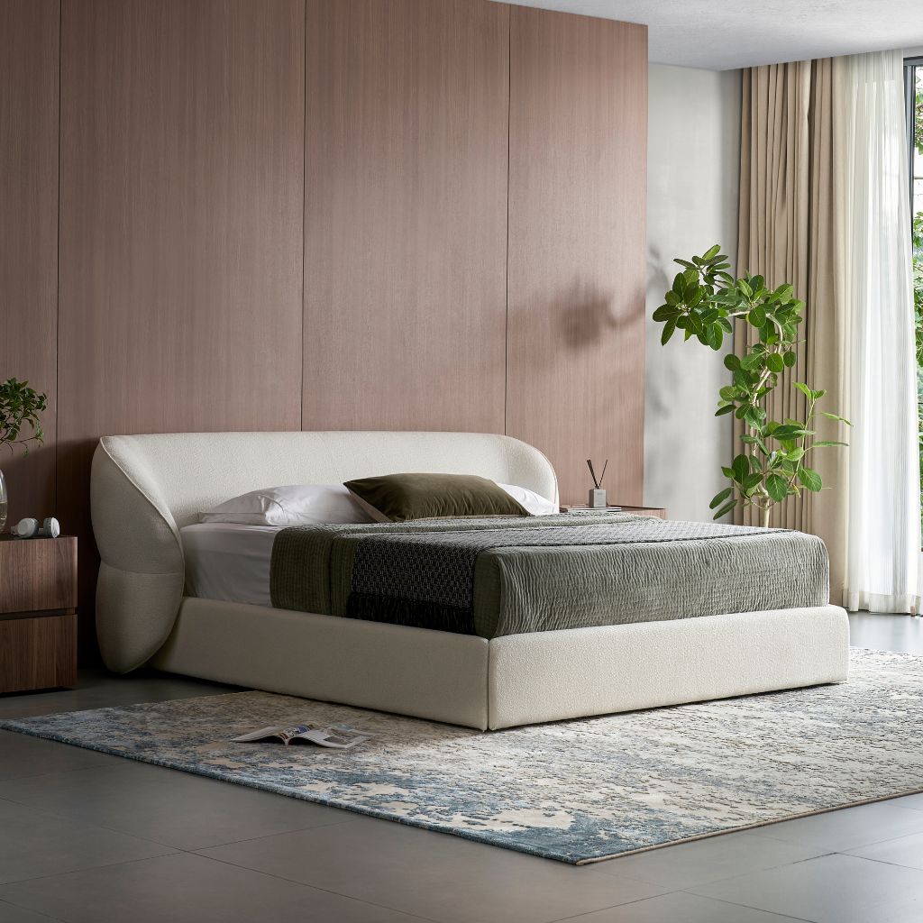 Pescara Bed with an elegantly curved upholstered headboard in a modern bedroom