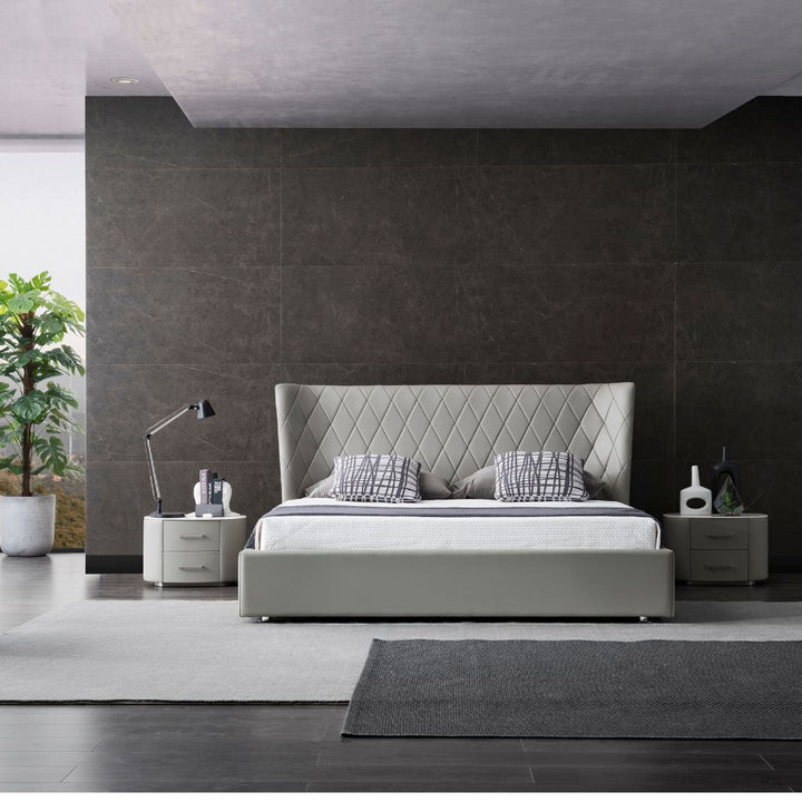 Verona Bed with a diamond quilt stitched headboard and upholstered frame in a modern bedroom