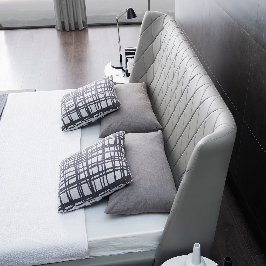 Verona Bed in leather showing the boxed-in upholstered frame