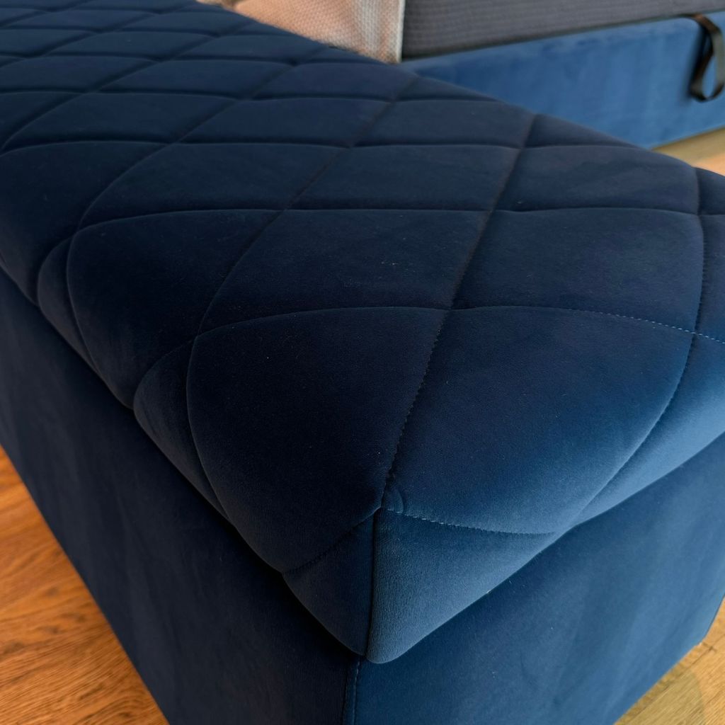 Verona Storage Ottoman showing the patterned seat and storage base