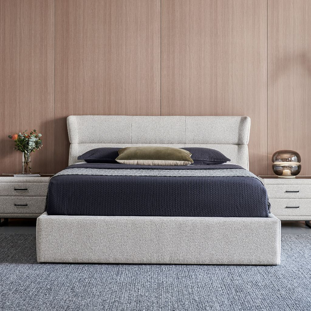Windsor Bed with a curved stitched headboard and low upholstered frame in a modern bedroom