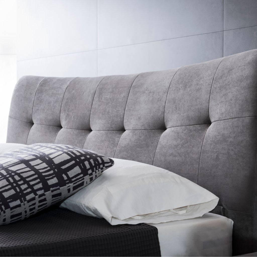 Vira Bed in King size showing the low frame and tufted headboard